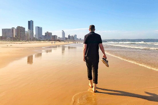 Reine walking the beach of Durban